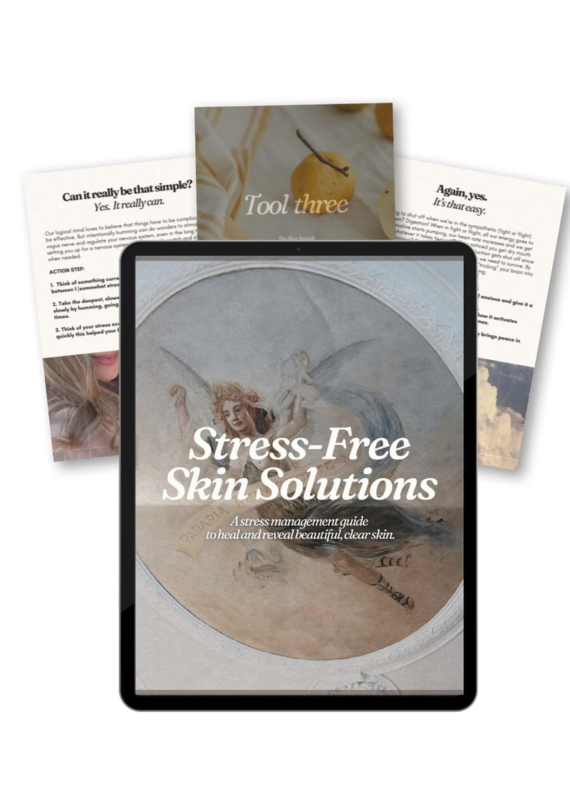 The Stress-Free Skin Solutions guide shown on a tablet, printed pages fanned behind it